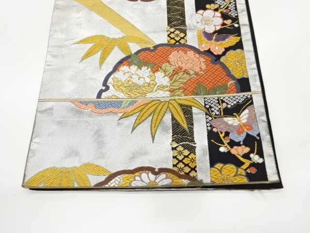  作家物　雪輪に花々・蝶・竹模様織出し袋帯